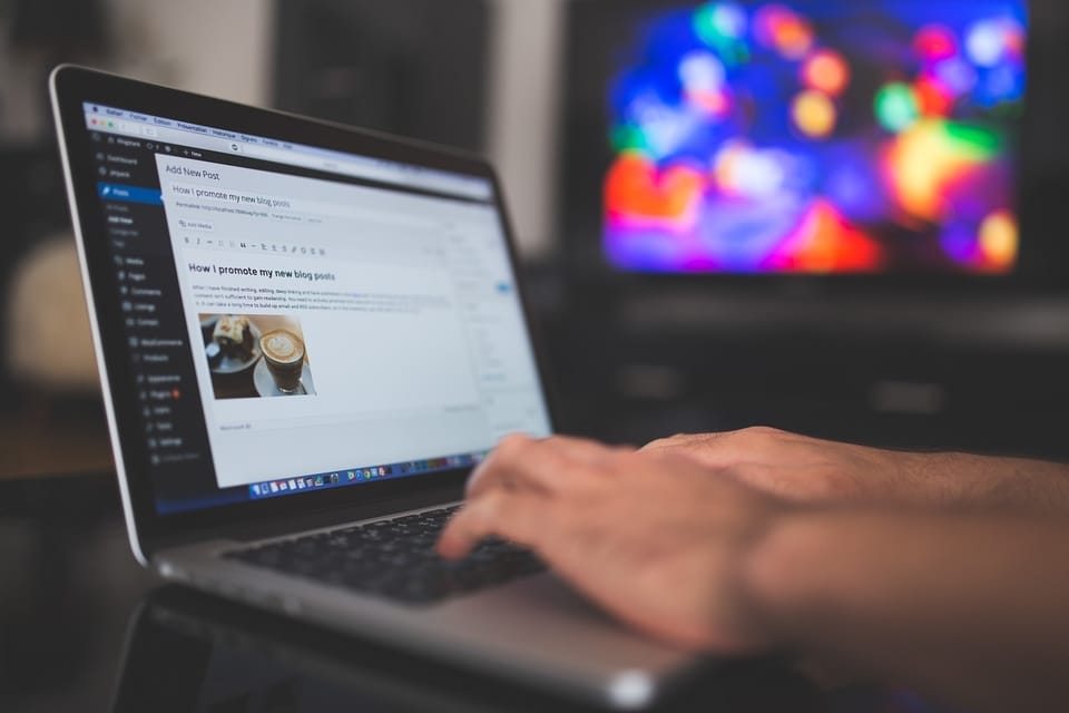 individual typing on a computer